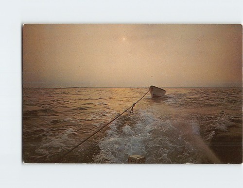 Postcard towing dory behind - postcard,